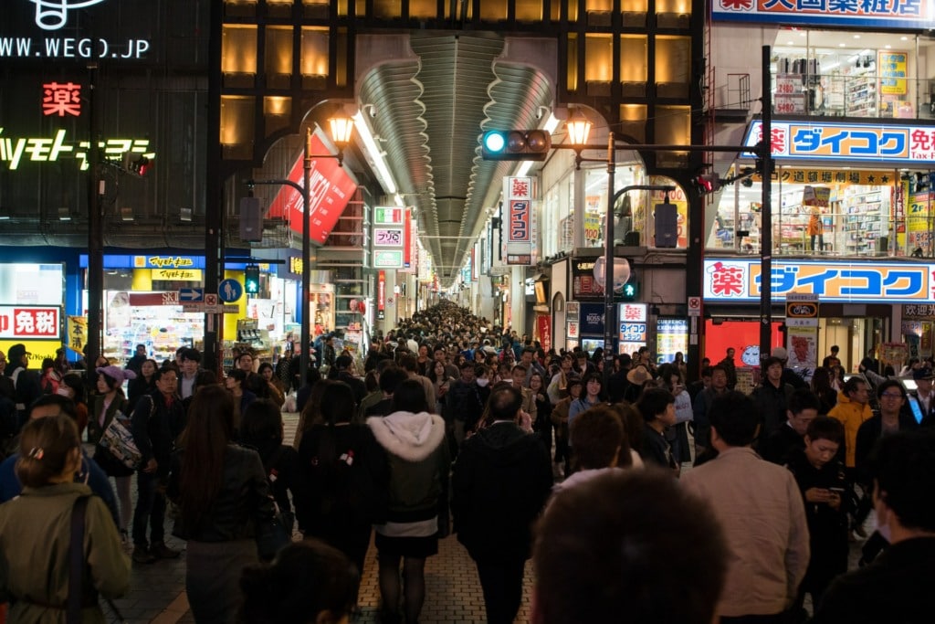 Night Scene of Dotonbori Japan with busy shoppers walking around