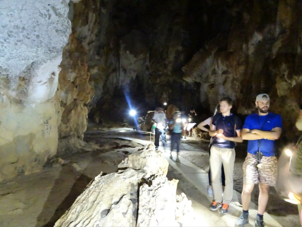 Tourists explore Limestone Caves in Thailand