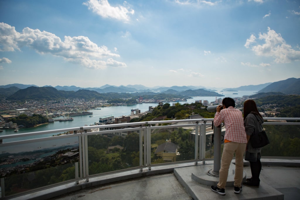 Couple in Observatory looking on Hiroshima cityscape
