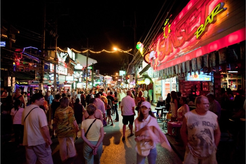 People walking in the crowded streets of Phuket full of entertainment