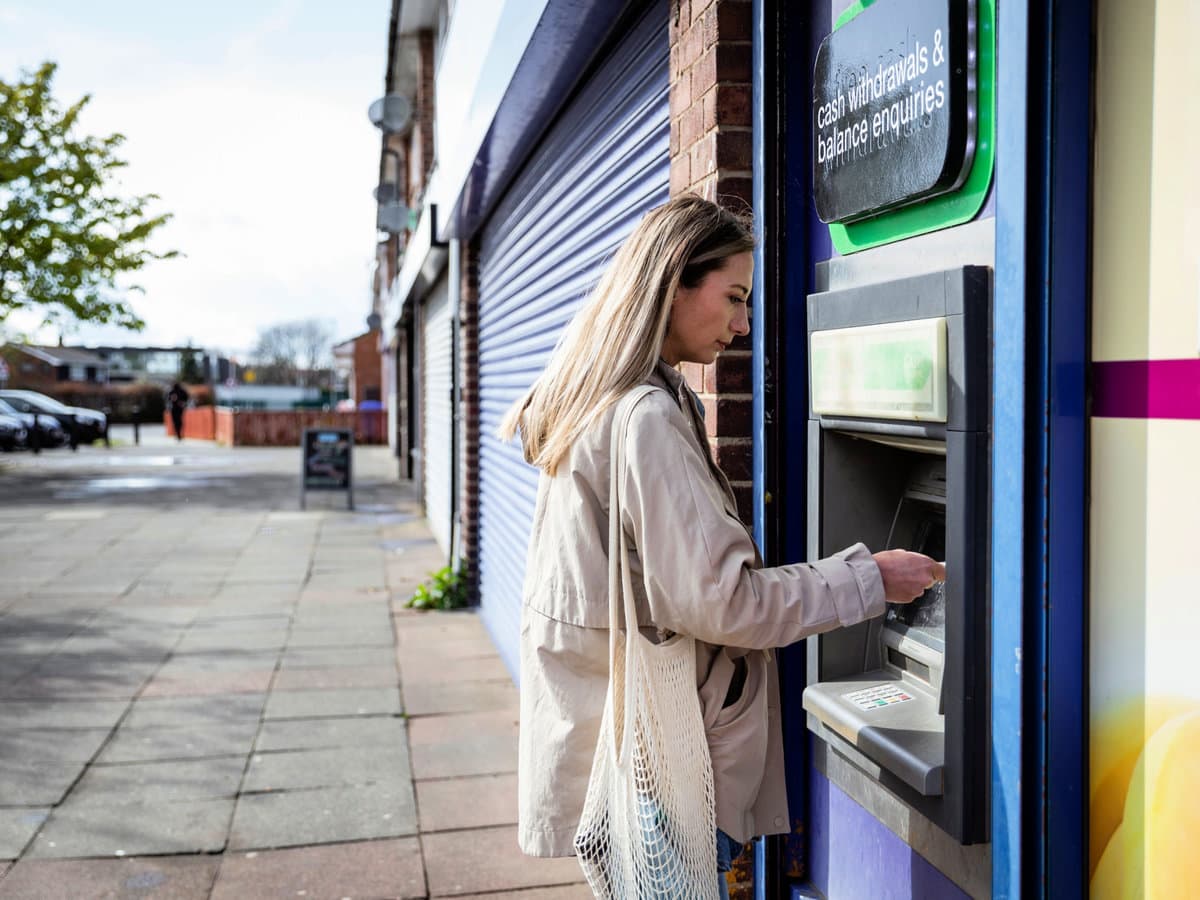 Woman Using a Cash Point