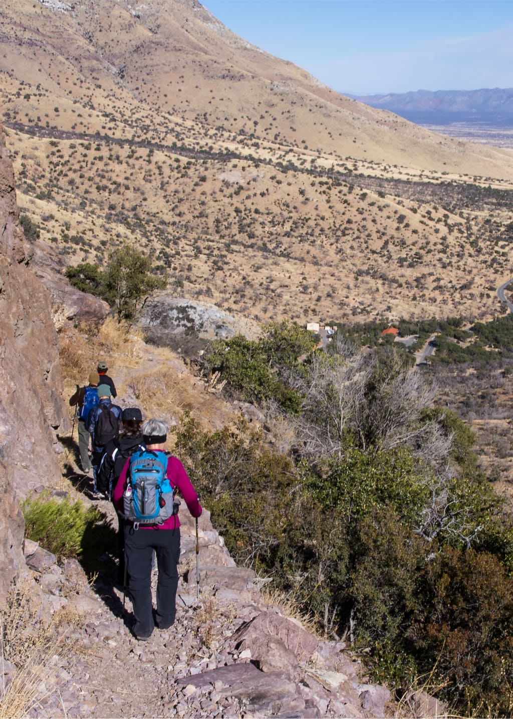 A group of hikers going down on rocky hiking track outside of Sierra Vista, Arizona