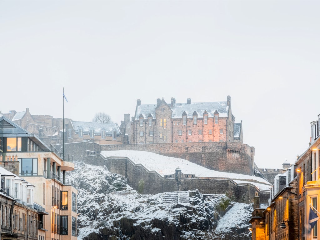 Edinburgh Castle under the snow as seen from Castle Street in New Town in the city centre of Edinburgh, Scotland