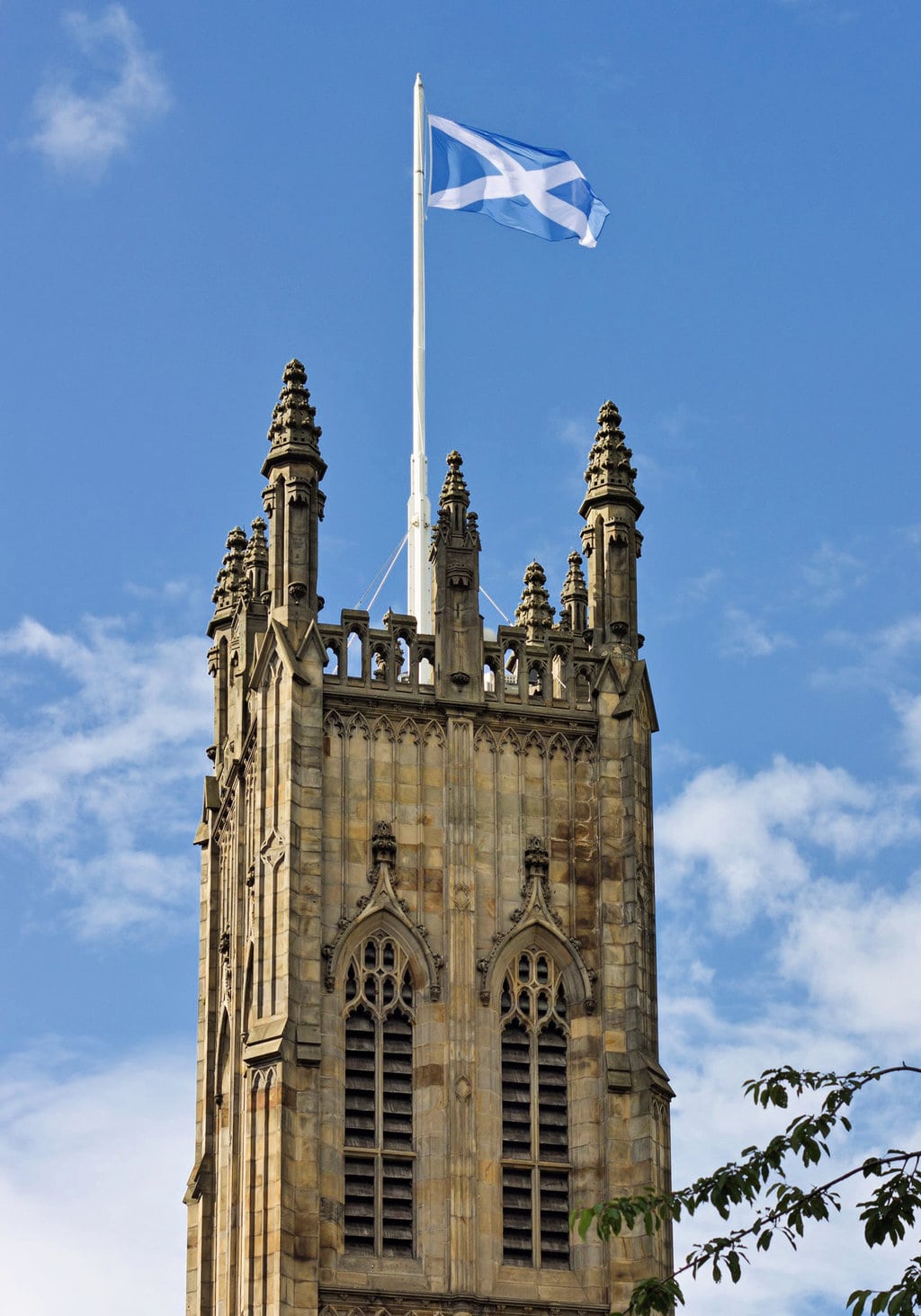 The Saltire Flag Flying on Top of a Medieval Tower in Edinburgh