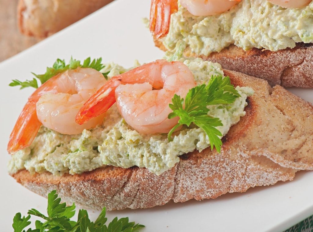 A serving of bruschetta with shrimps