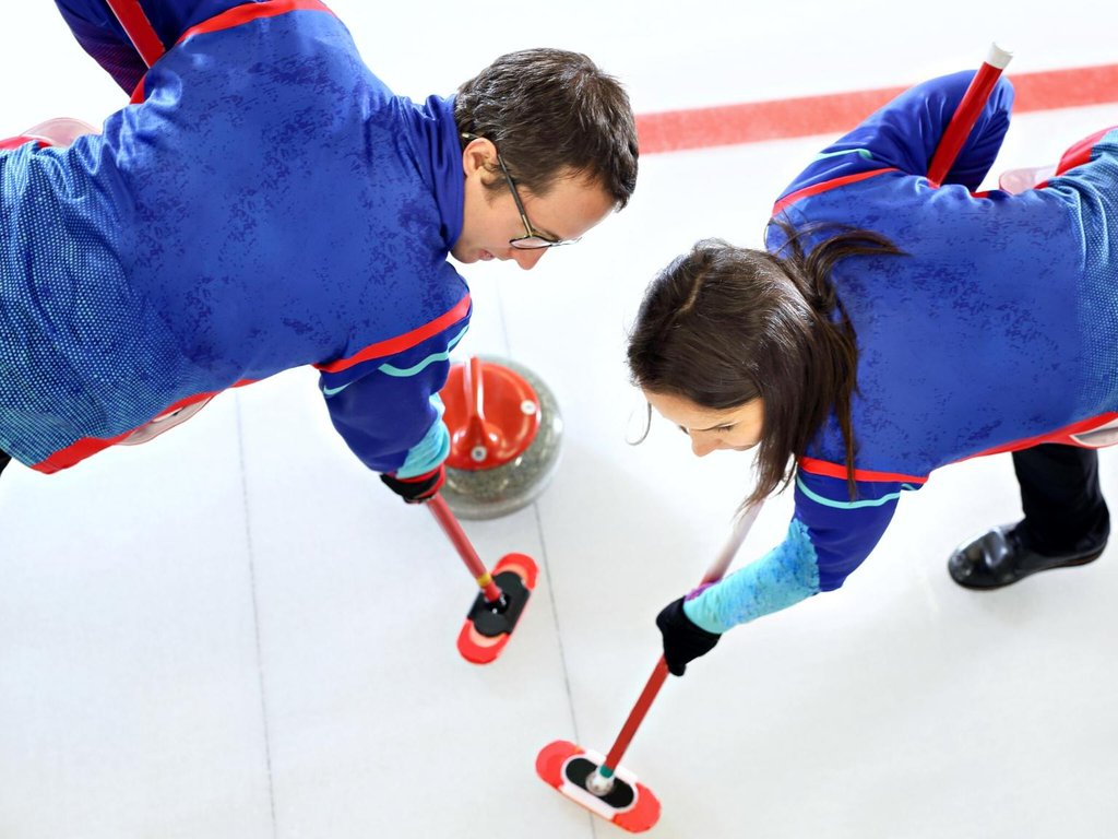 A curling team plays at a tournament