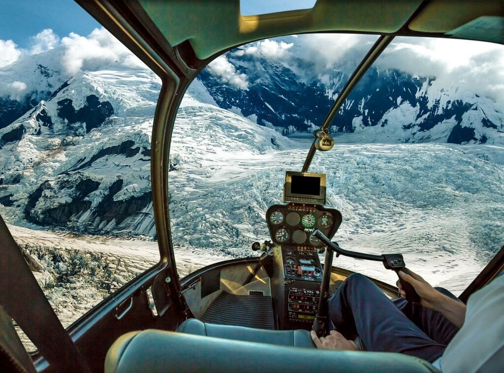 Flightseeing aboard a helicopter in Alaska in winter