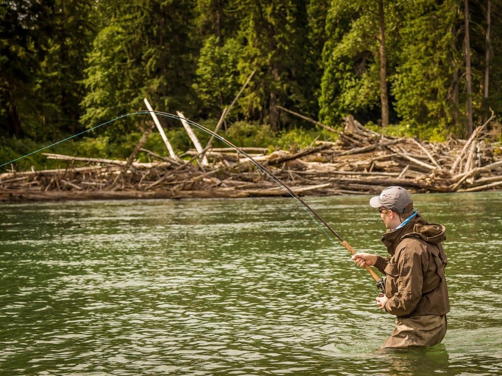 A man fishing for salmon in Alaska