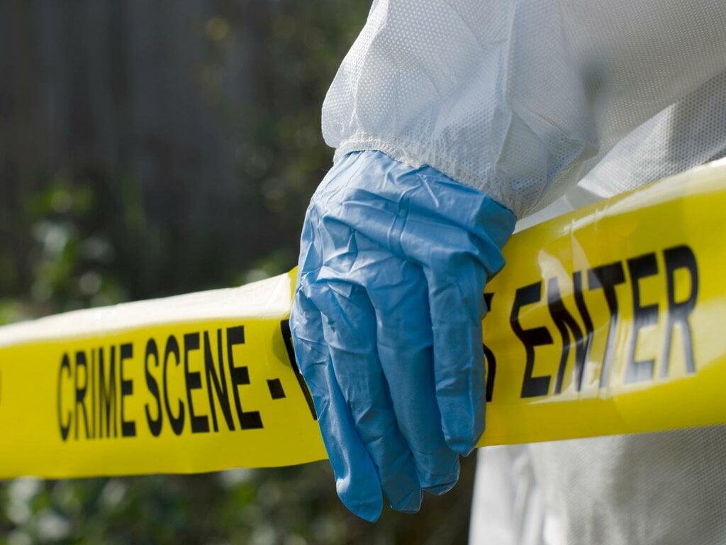 A yellow barricade tape at a crime scene