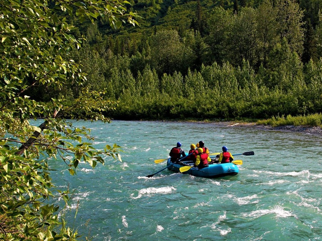 People on a rafting trip in Sixmile Creek in Alaska