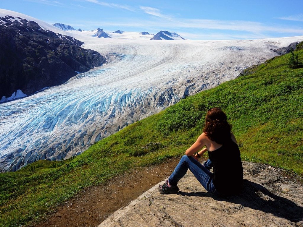 A woman looks on at the Exit Glacier in Alaska
