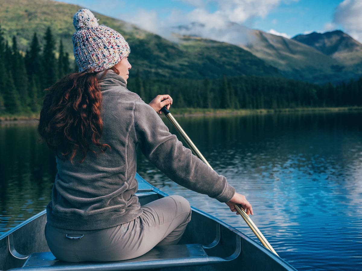 A girl on a canoe at Juneau Lake, Alaska