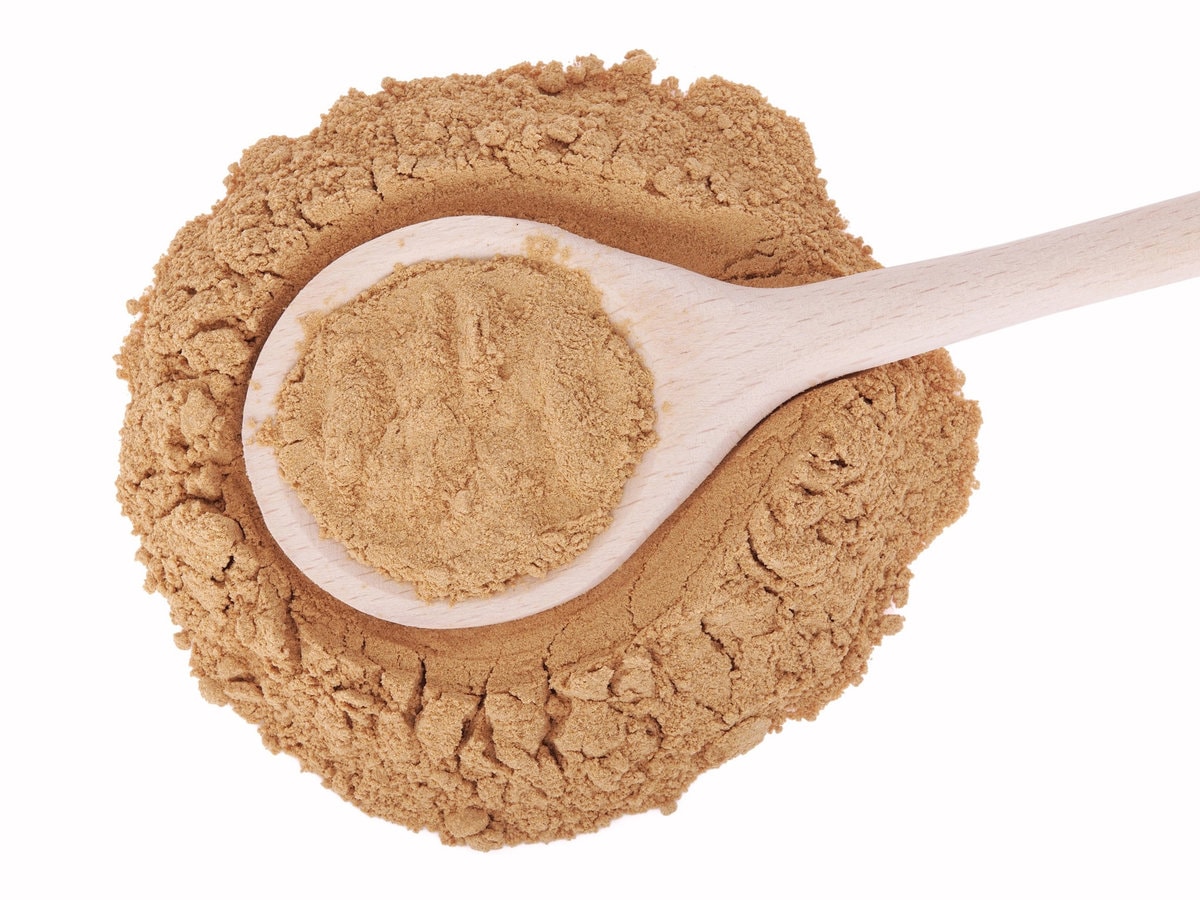 Mesquite powder in a wooden spoon
