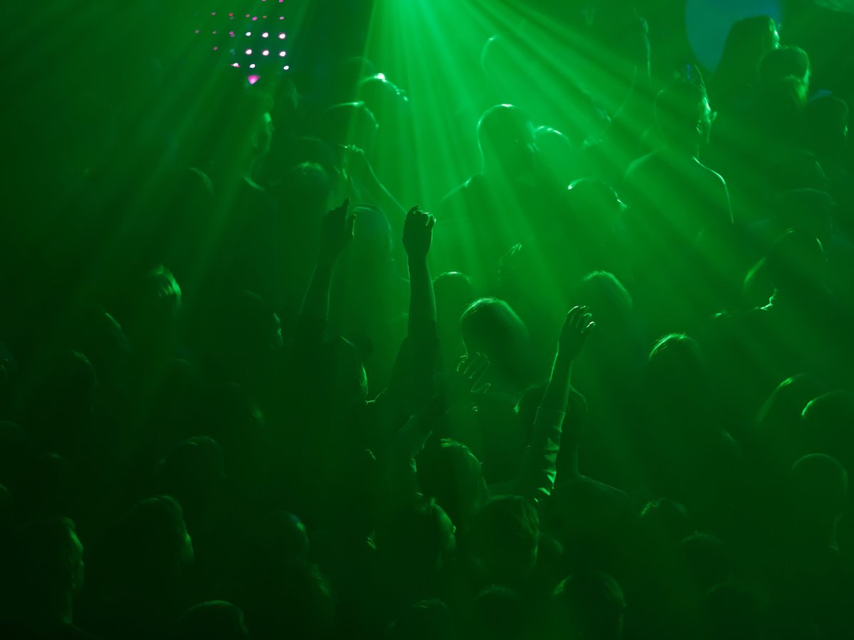 A crowd having fun at a techno club