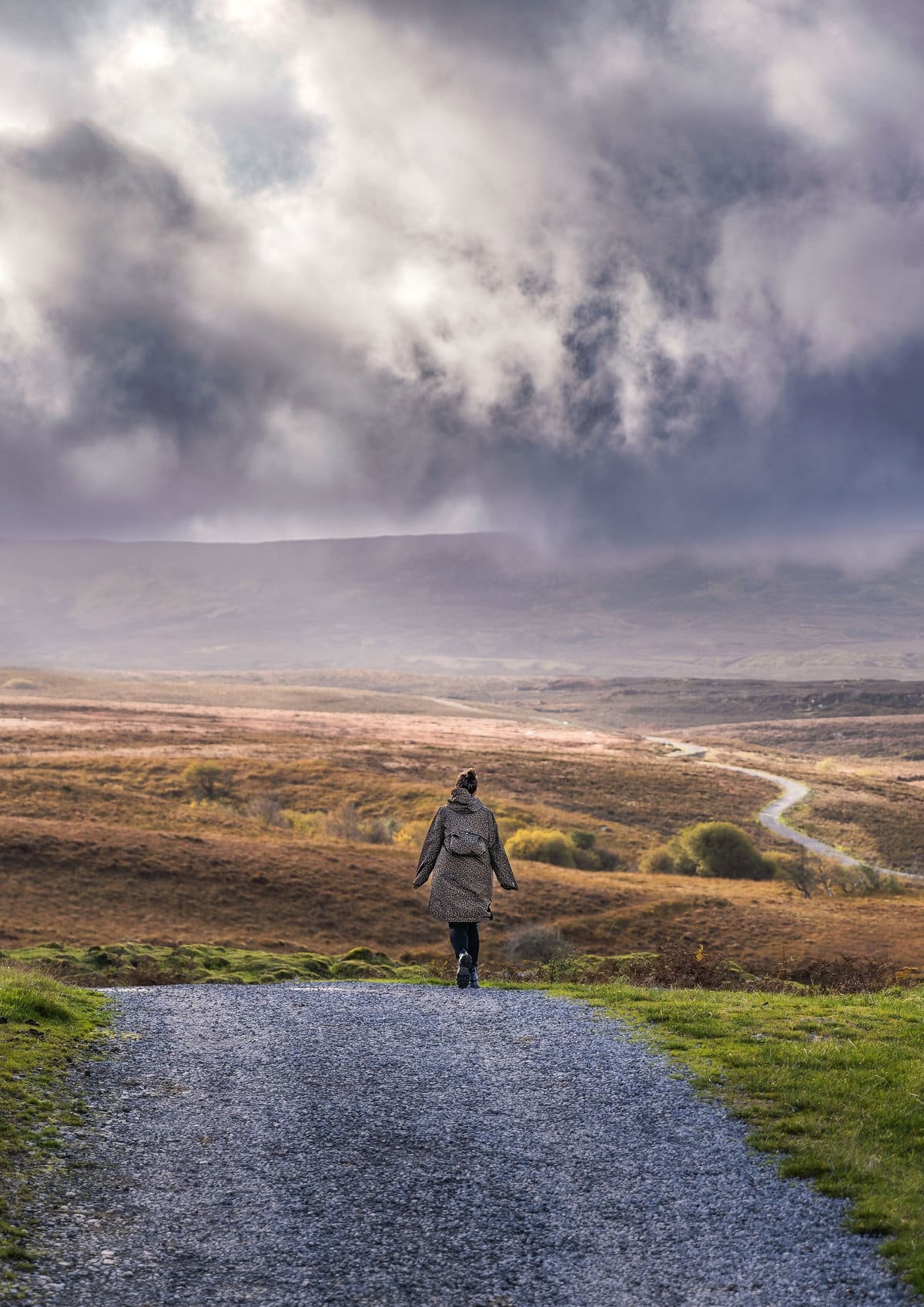 A woman hiking a beautiful countryside trail in Fermanagh, Northern Ireland
