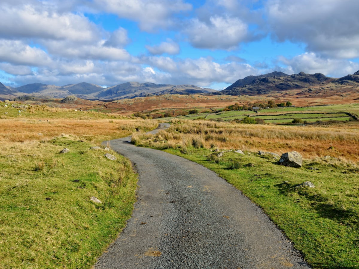 A winding country lane in the Lake District National Park