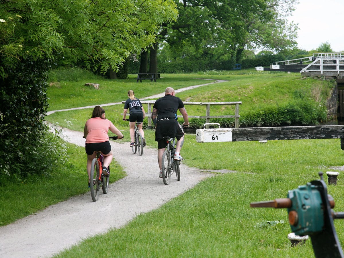 Cyclists on the tow path in Whittle Springs, Lancashire, England