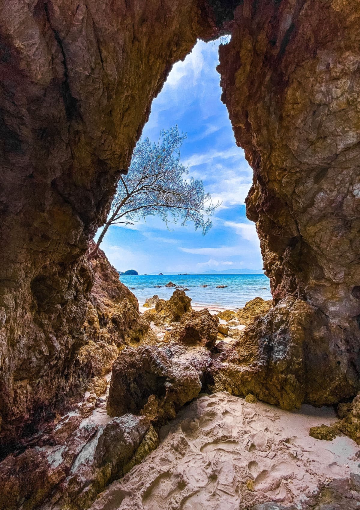 Koh Phayam beach with rock arch formation in Ranong, Thailand