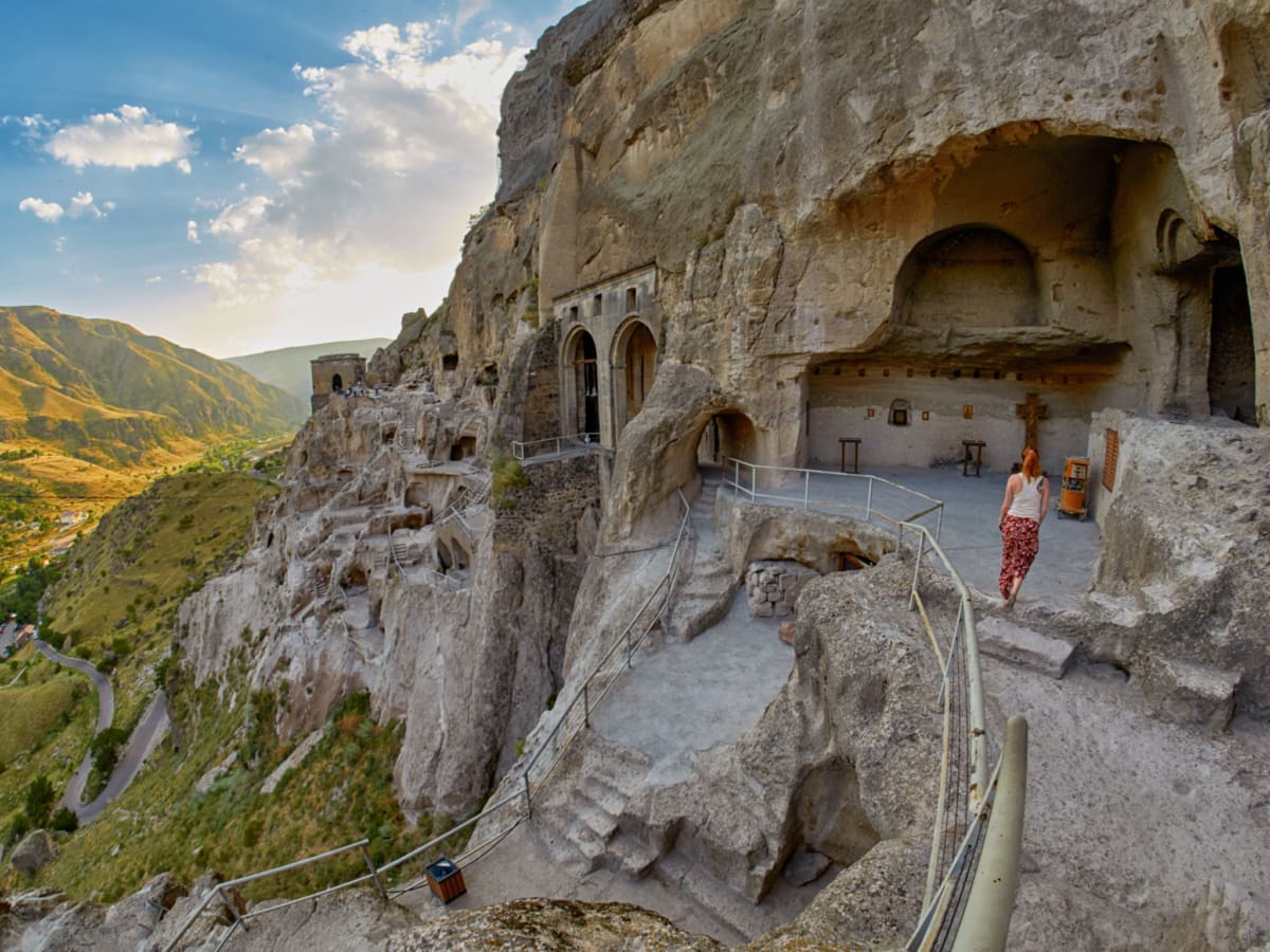 A tourist at the Vardzia Cave Monastery in Georgia