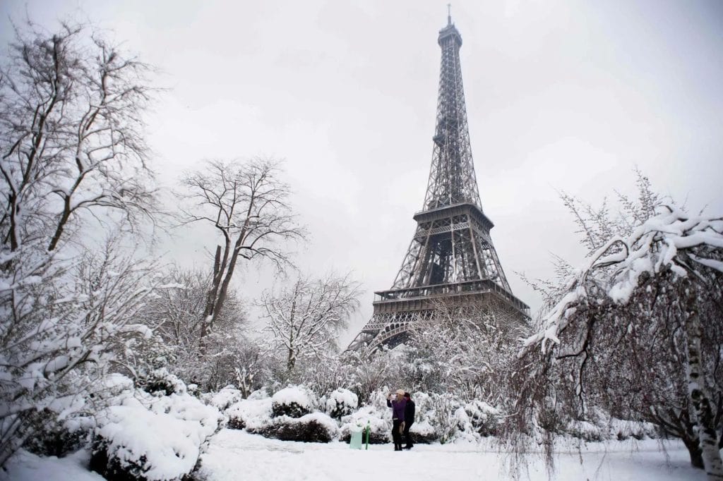 Eiffel Tower under the snow during winter in Paris