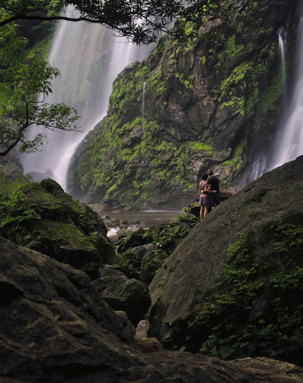 Couple watching on Khlong Lan Waterfall in Thailand