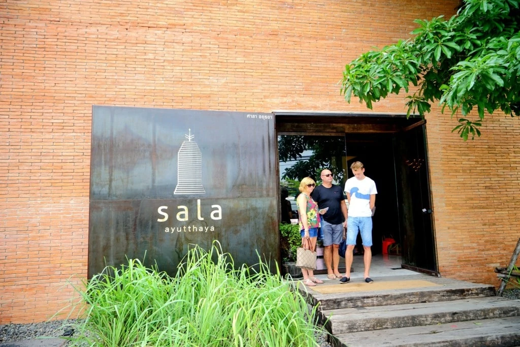 Tourists on the entrance to the Sala Ayutthaya resort in Thailand