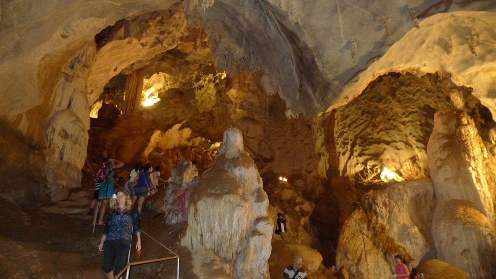 Tourists exploring cave in Krabi, Thailand
