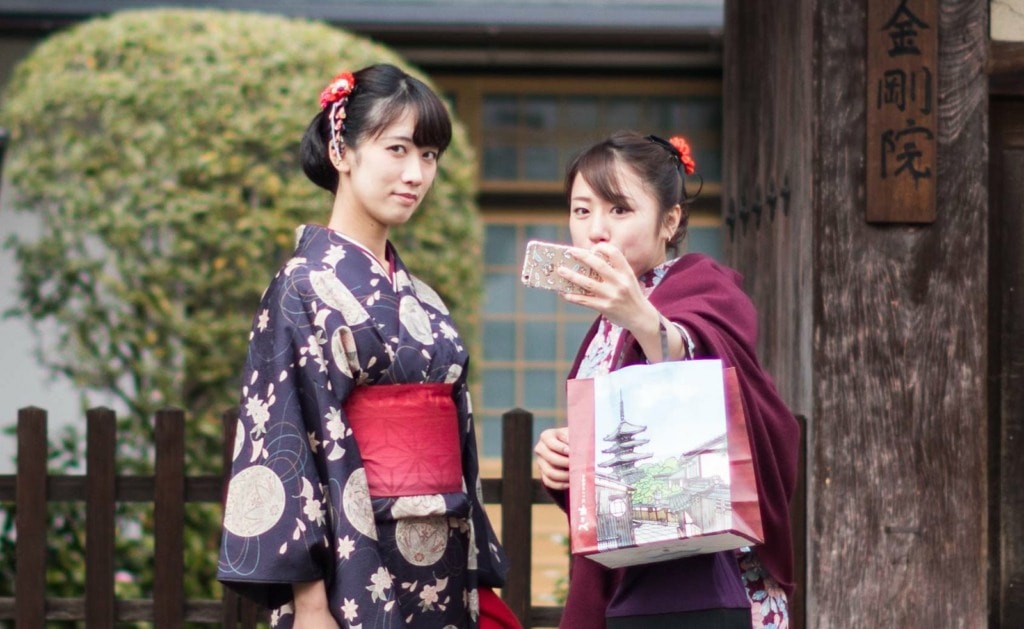 Geisha make selfies in Kyoto