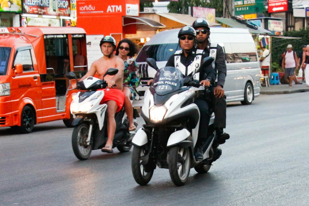 Officers driving motorbike in Thailand