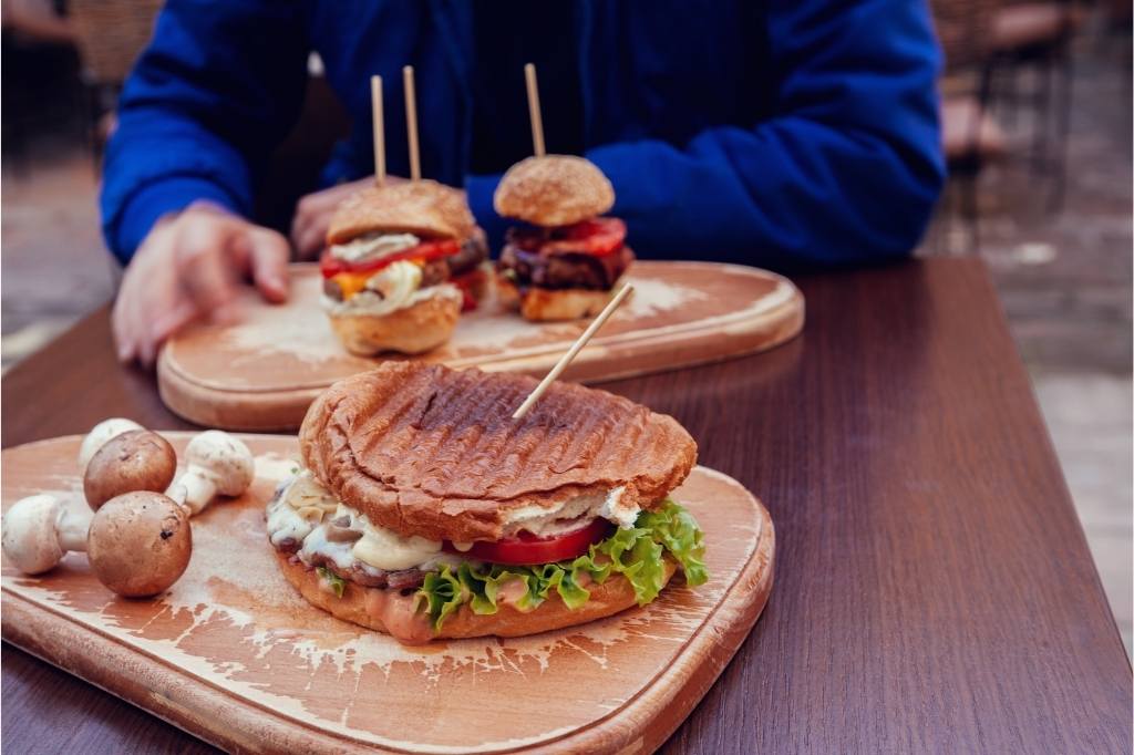 Delicious Burgers Served On Desk in English pub
