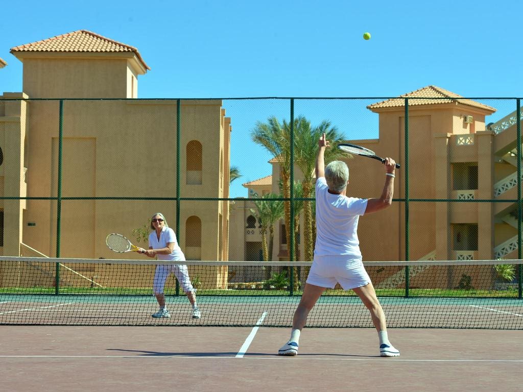 A Couple Playing Tennis at a Tennis Resort