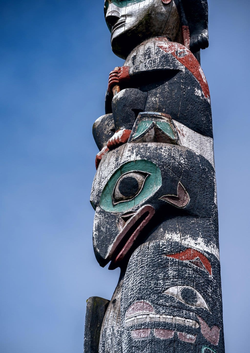 A closeup of a totem pole in Sitka, Alaska