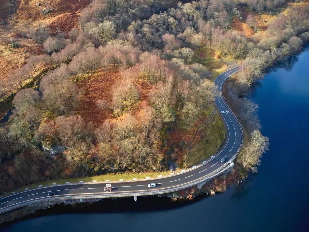 Aerial View of the A82 Road Along the Loch Lomond During Autumn